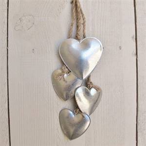 Four hanging metal hearts