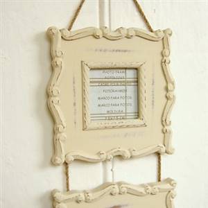 Cream hanging photo frames