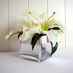 Lilies in mirror cube vase